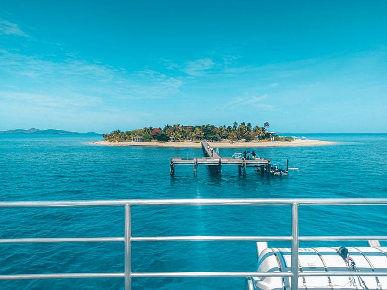 white and blue boat on sea during daytime